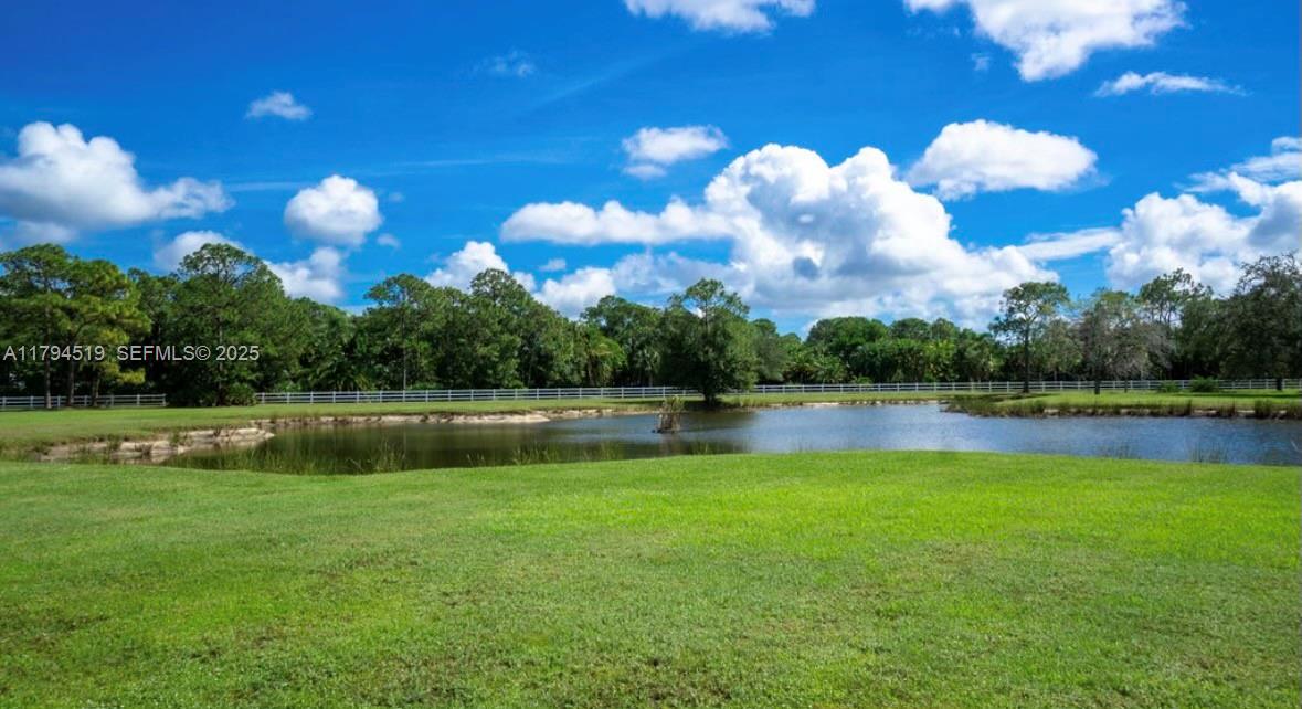 1901 Southeast Ranch Road South Jupiter, FL 33478 - Photo 50 of 53 a view of a lake and houses in the background