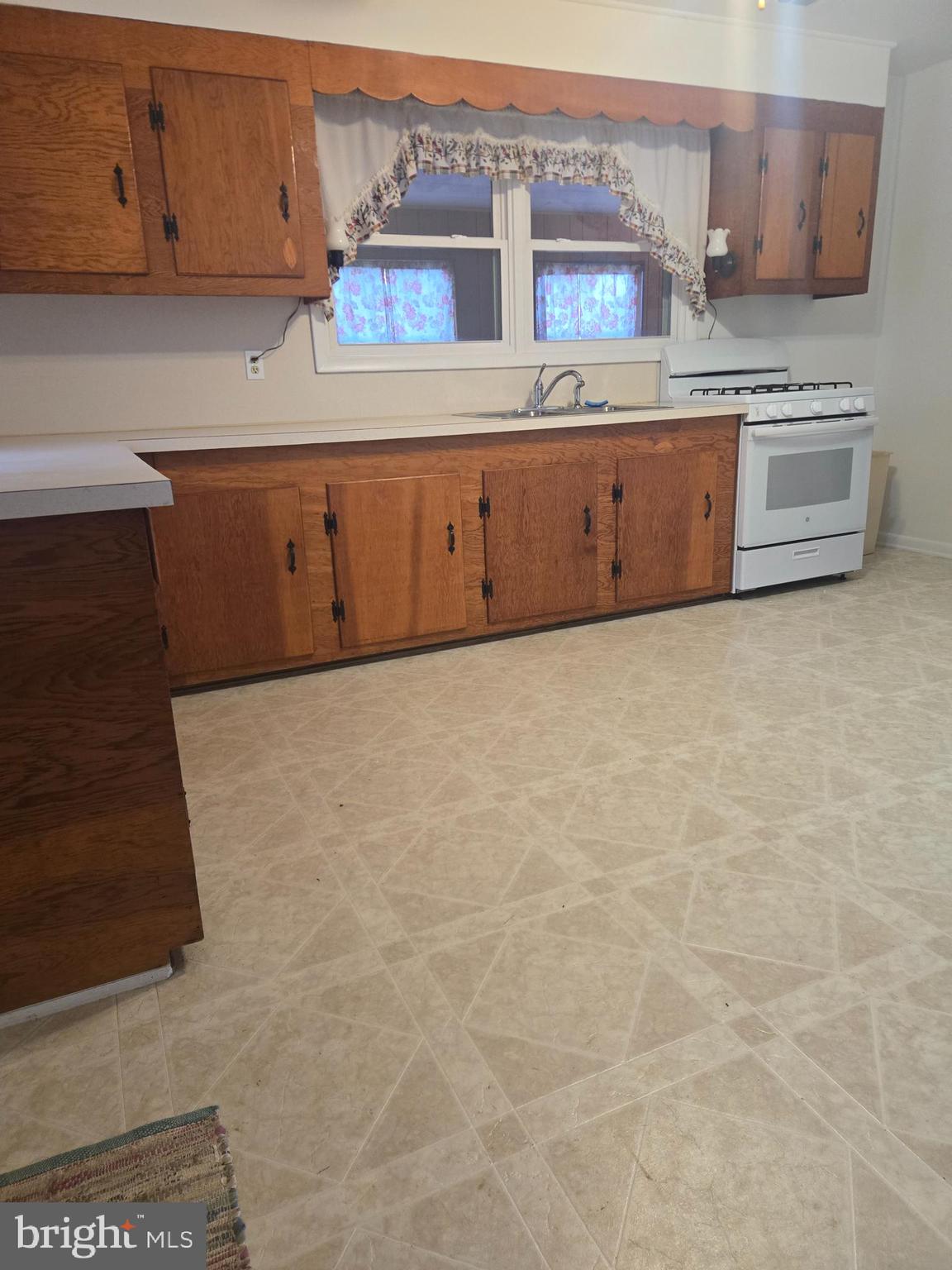 1903 Glen Cove Road Darlington, MD 21034 - Photo 11 of 21 a kitchen with granite countertop white cabinets and stainless steel appliances