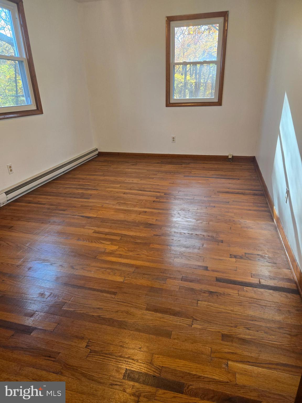 1903 Glen Cove Road Darlington, MD 21034 - Photo 13 of 21 an empty room with wooden floor and windows