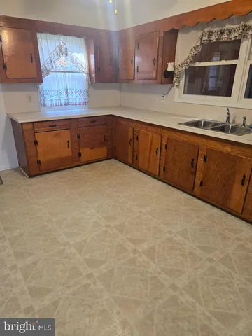 a kitchen with stainless steel appliances granite countertop a stove and a refrigerator