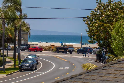 a view of a street with cars