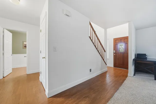 a living room with furniture fireplace and flat screen tv