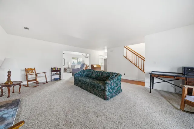 a bathroom with a toilet a sink and a mirror