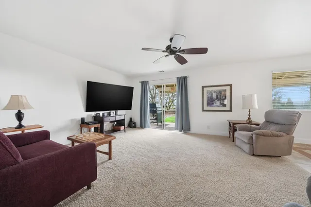 a spacious bedroom with a bed and a cabinets