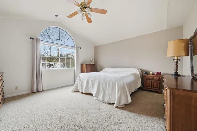 a bedroom with a bed and a closet