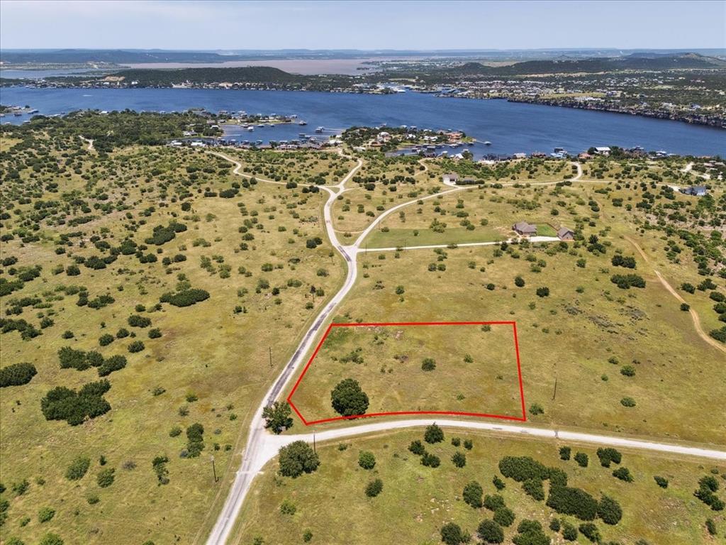 Lot 75 Lake Shore Loop Graford, TX 76449 - Photo 1 of 21 Aerial View of Lot and Lake Featuring Property Parcel Outlined
