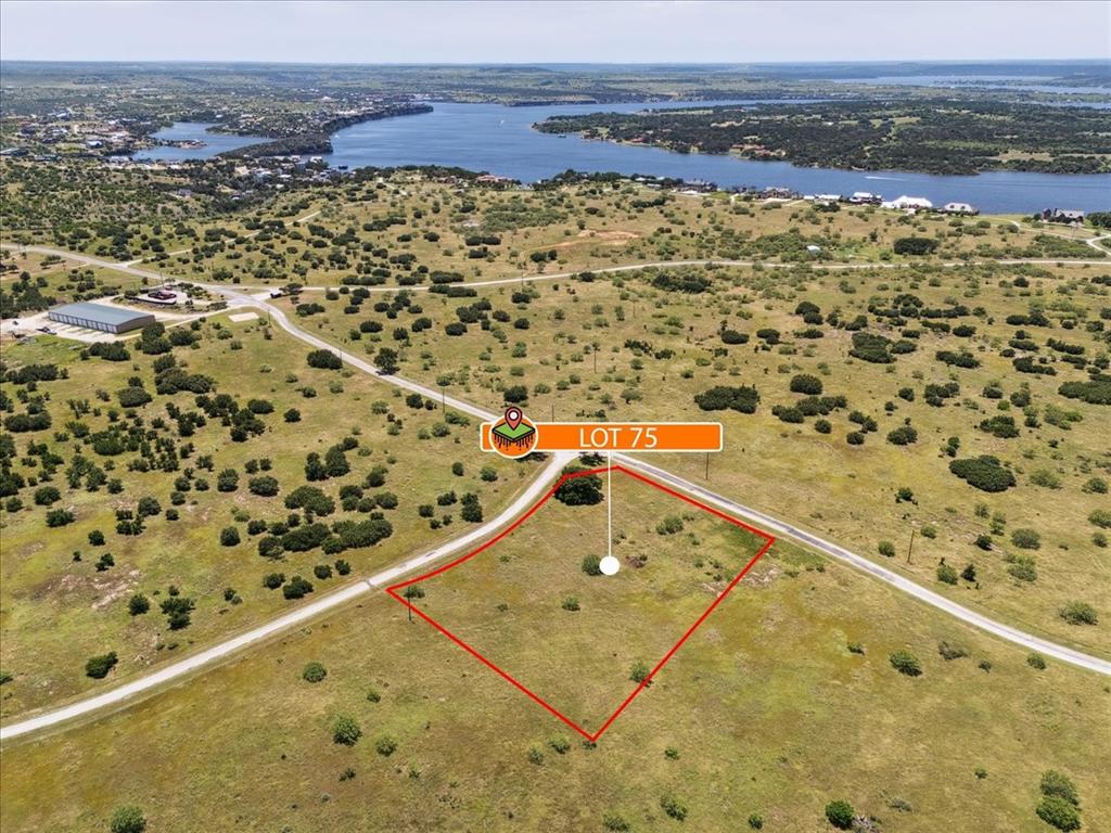 Lot 75 Lake Shore Loop Graford, TX 76449 - Photo 15 of 21 Aerial view of property's location with a nearby body of water and property boundaries highlighted