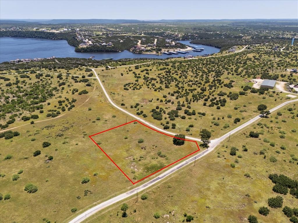 Lot 75 Lake Shore Loop Graford, TX 76449 - Photo 7 of 21 Aerial View of Lot and Lake Featuring Property Parcel Outlined