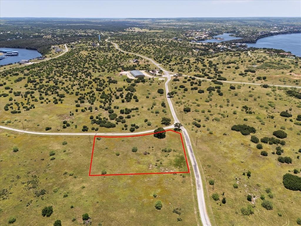 Lot 75 Lake Shore Loop Graford, TX 76449 - Photo 8 of 21 Aerial View of Lot and Lake Featuring Property Parcel Outlined