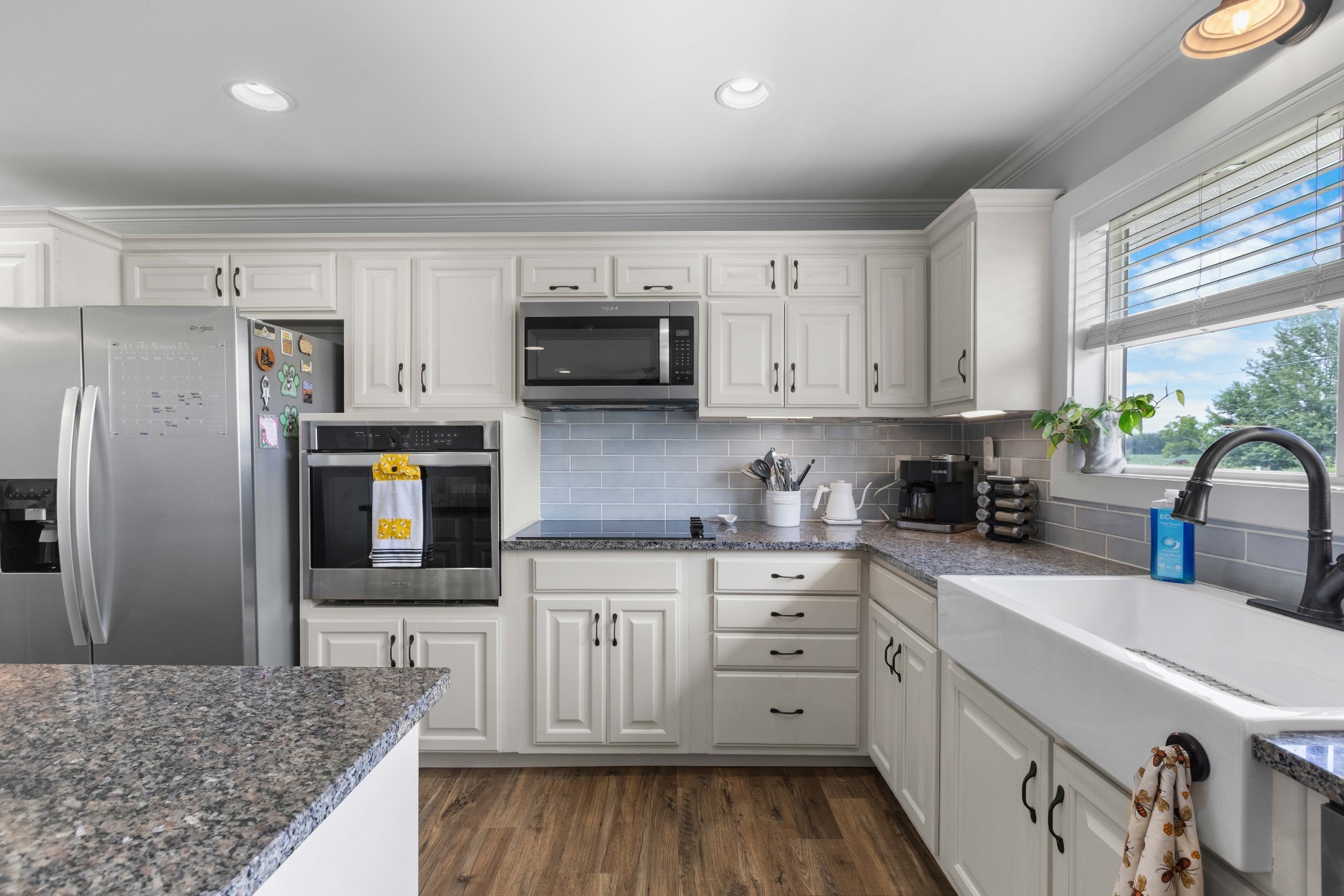 294 McDale Road Shelbyville, TN 37160 - Photo 12 of 47 a kitchen with stainless steel appliances granite countertop a stove a sink a refrigerator a microwave and cabinets