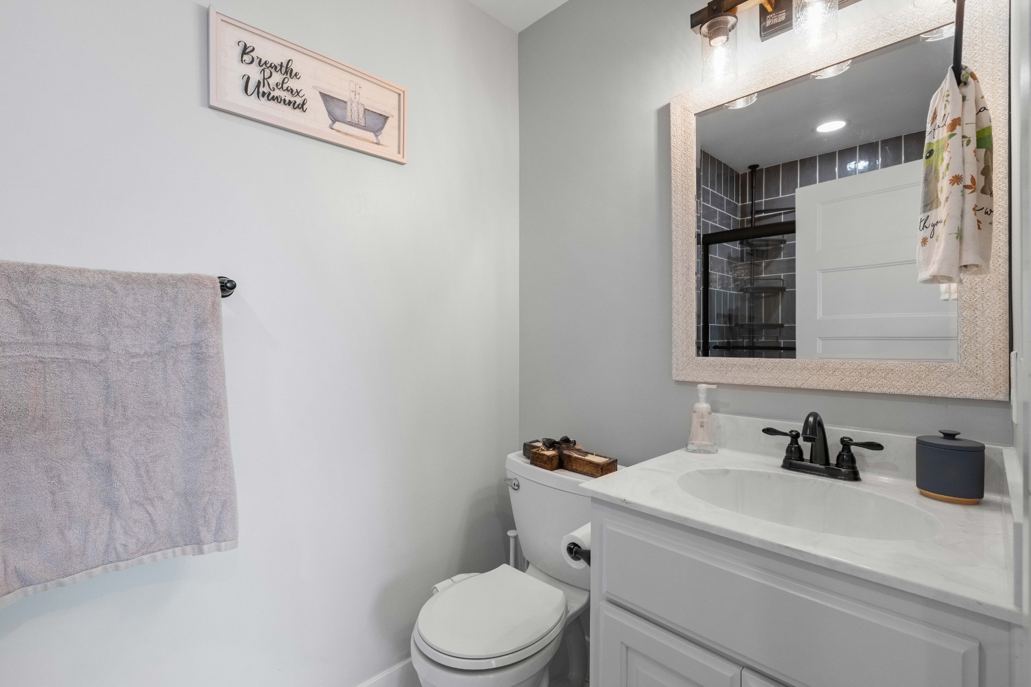 294 McDale Road Shelbyville, TN 37160 - Photo 18 of 47 a bathroom with a granite countertop sink mirror vanity and toilet
