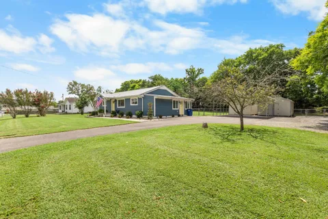 a view of house with a garden