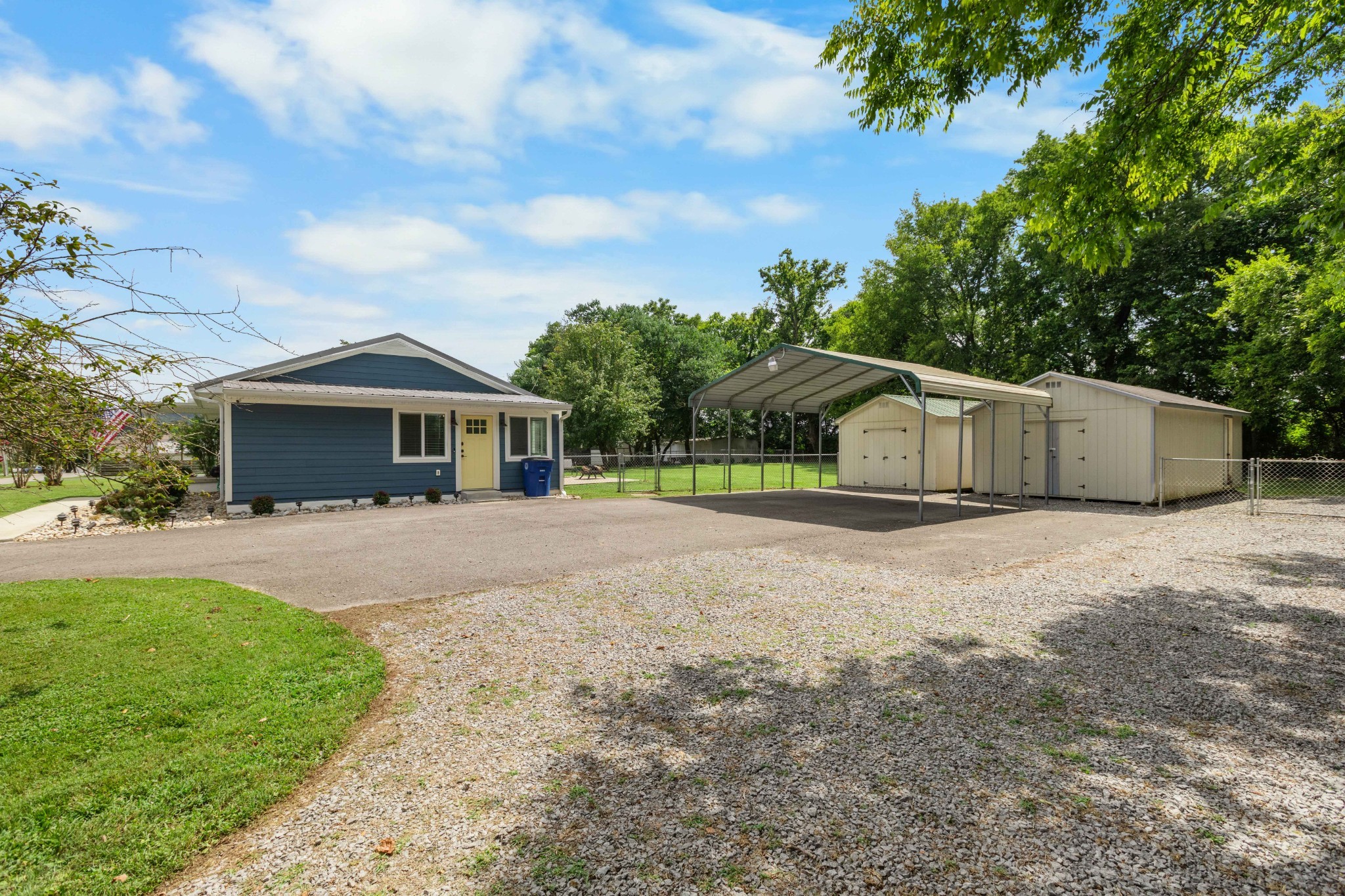 294 McDale Road Shelbyville, TN 37160 - Photo 38 of 47 a front view of a house with a yard and garage