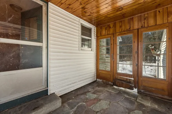 a view of front door and yard