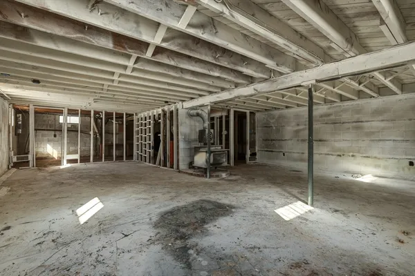 a view of a room with wooden walls