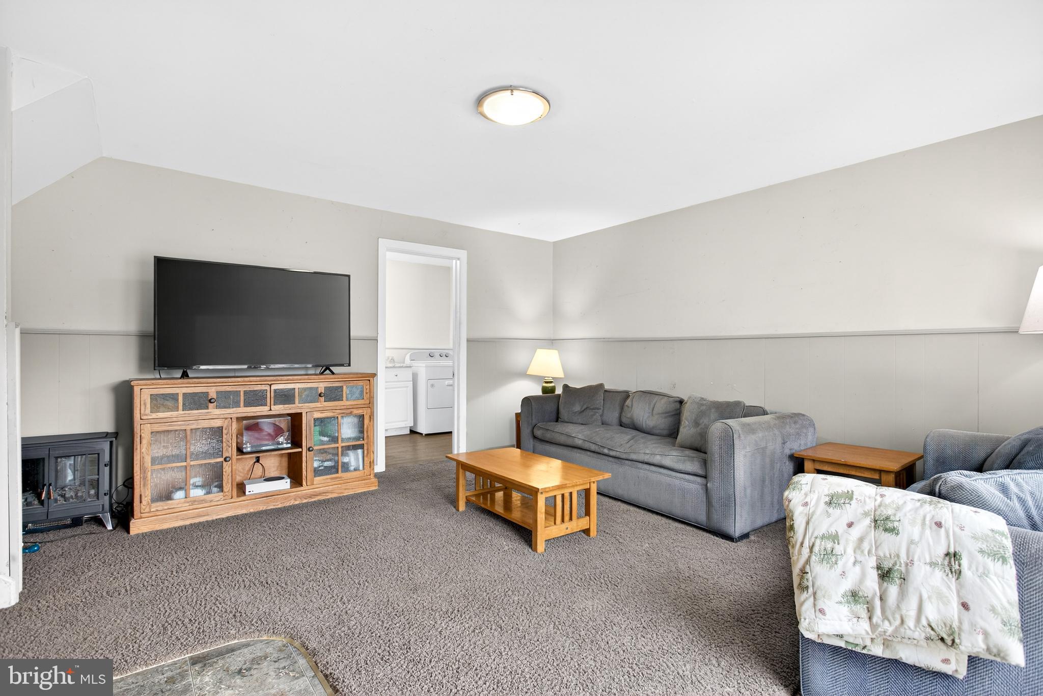 26 Austin Road Yardley, PA 19067 - Photo 11 of 33 a living room with furniture and a flat screen tv