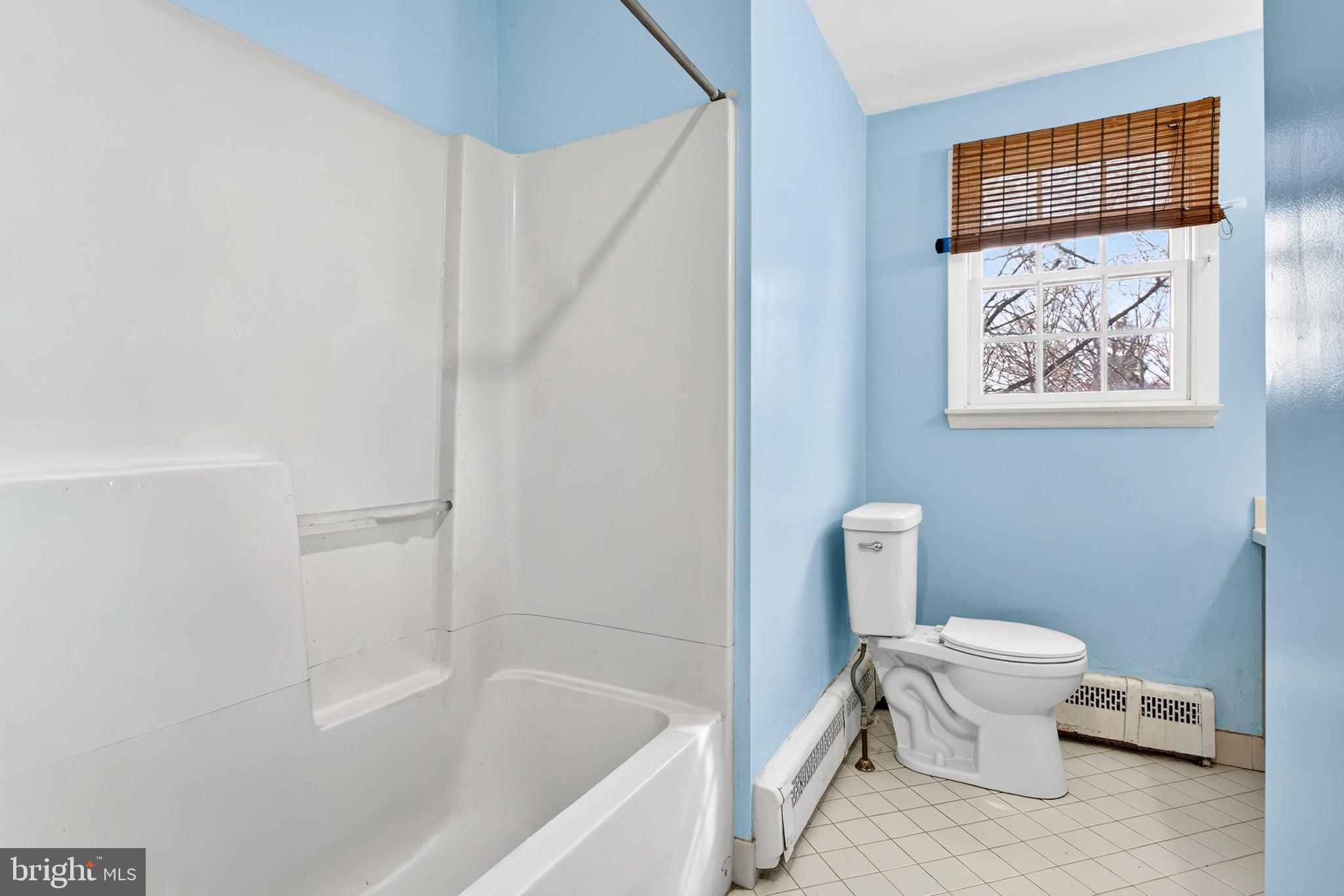 26 Austin Road Yardley, PA 19067 - Photo 21 of 33 a white toilet sitting next to a bathroom sink