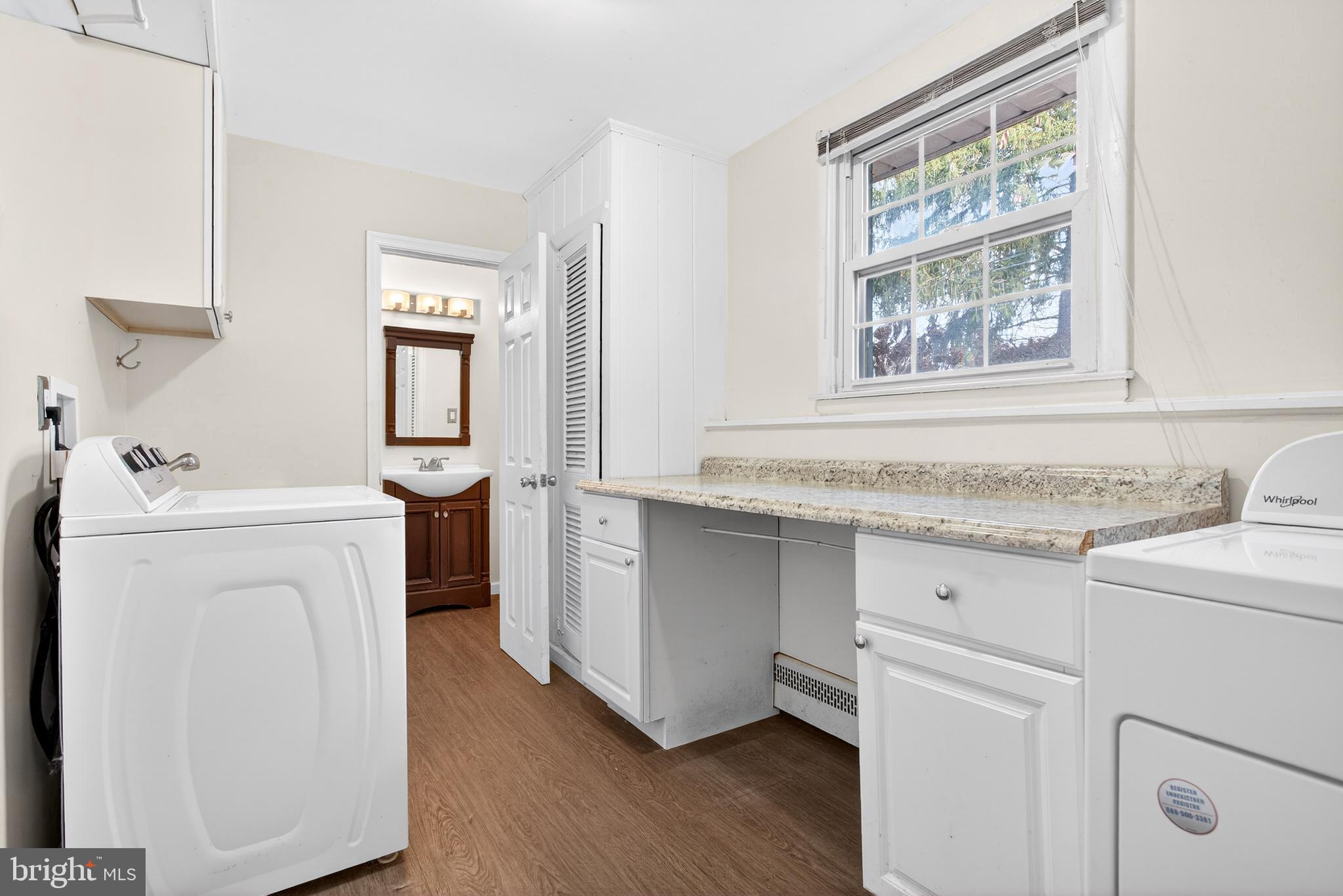26 Austin Road Yardley, PA 19067 - Photo 25 of 33 a utility room with sink dryer and washer