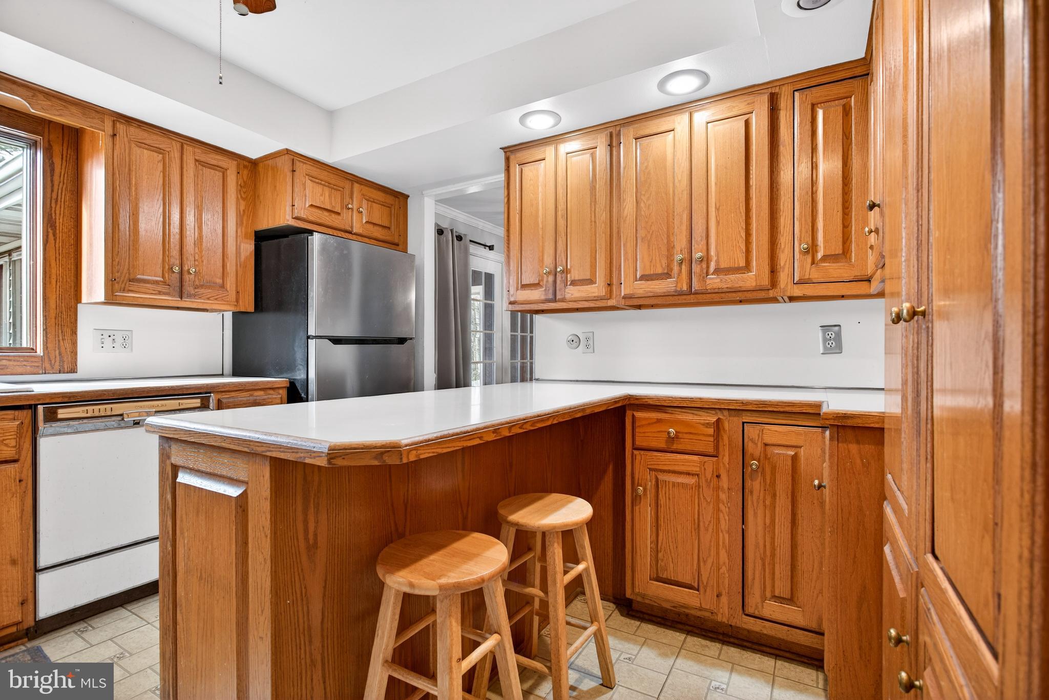 26 Austin Road Yardley, PA 19067 - Photo 6 of 33 a kitchen with stainless steel appliances a refrigerator and a window