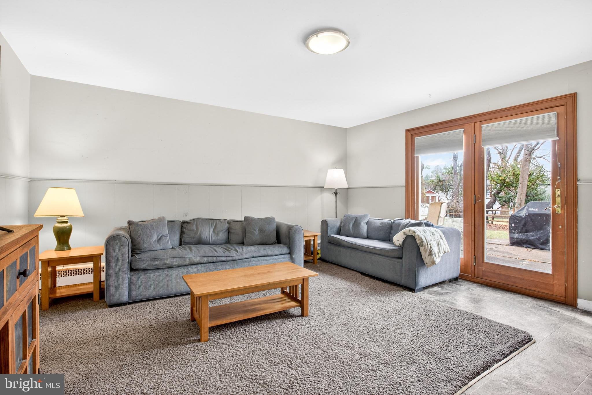 26 Austin Road Yardley, PA 19067 - Photo 9 of 33 a living room with a couch and a window