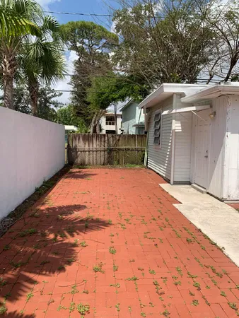 a view of a backyard of the house