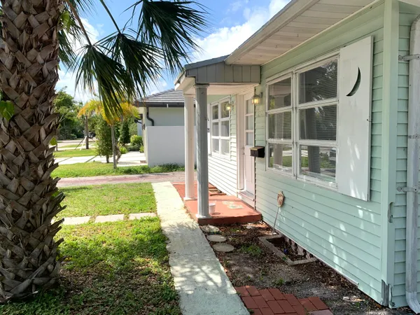 a view of a backyard of the house