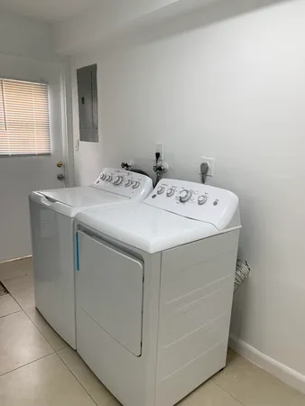 a utility room with washer and dryer