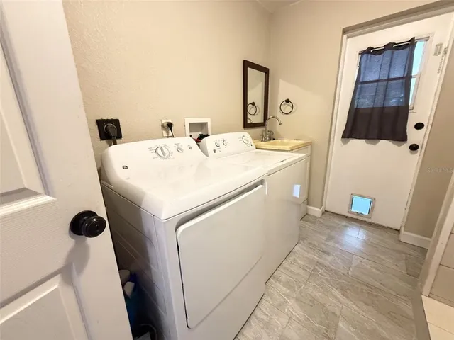 a utility room with dryer and washer