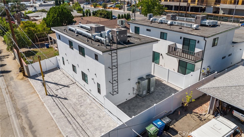 11140 Woodley Avenue, Unit 1/2 Granada Hills, CA 91344 - Photo 20 of 20 a white house sitting next to a yard