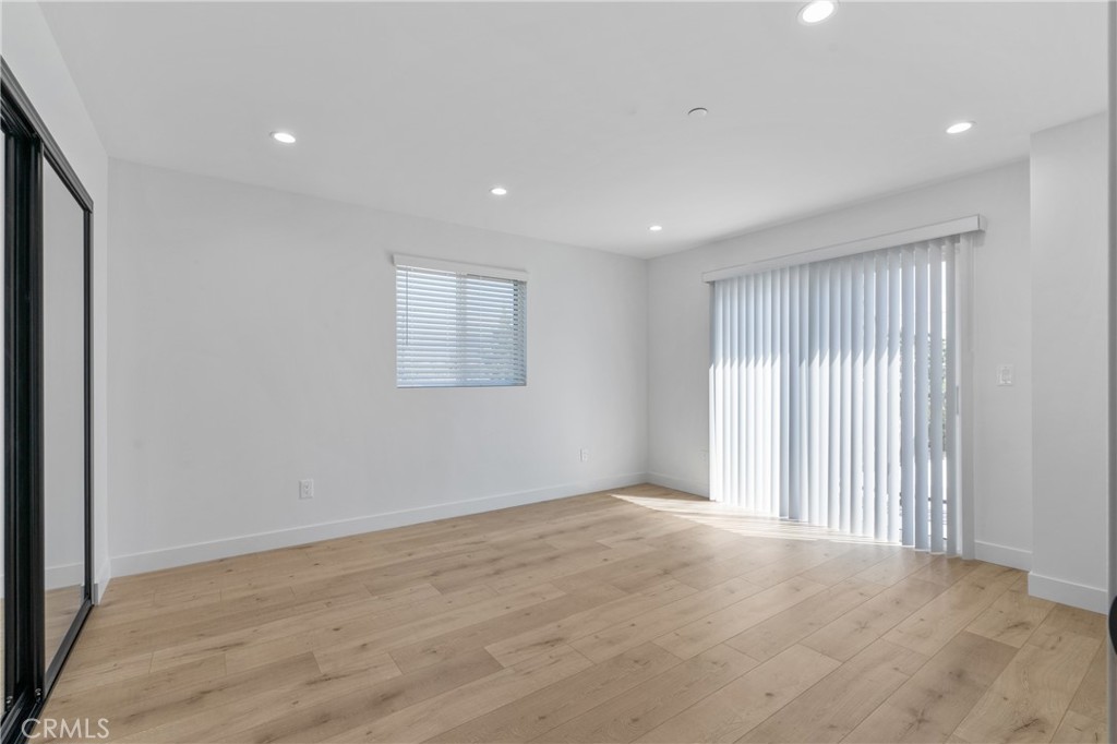 11140 Woodley Avenue, Unit 1/2 Granada Hills, CA 91344 - Photo 9 of 20 a view of an empty room with a window