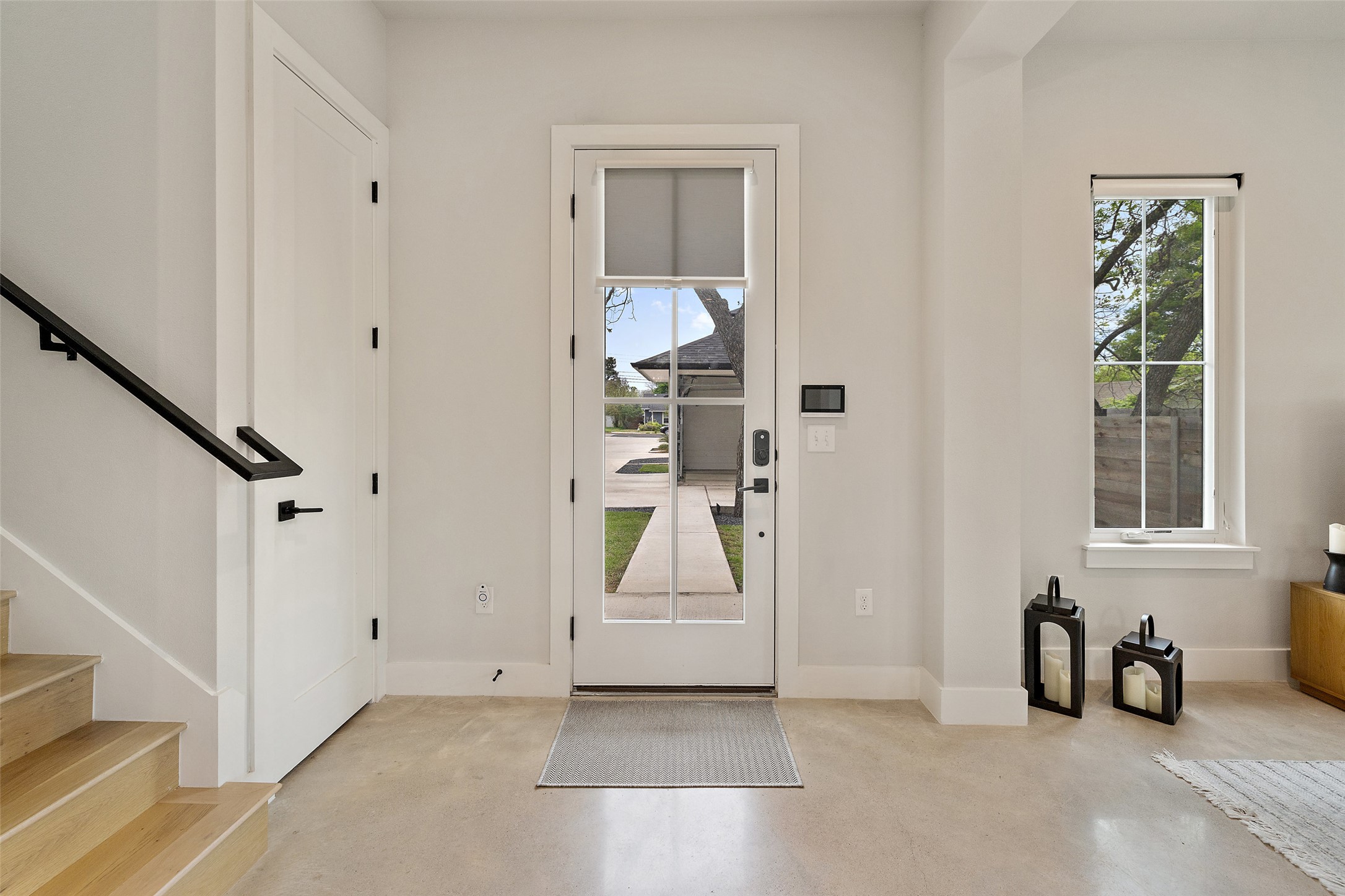 1504 Ruth Avenue, Unit 3 Austin, TX 78757 - Photo 3 of 39 A welcoming entry features abundant natural light and seamless concrete flooring.