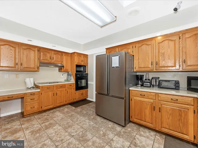 a view of a kitchen with a sink and cabinets