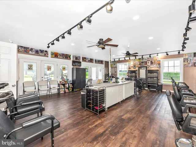 a living room with lots of furniture and kitchen view