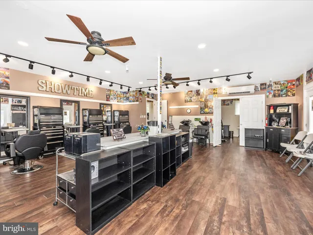 a dinning room with furniture and wooden floor