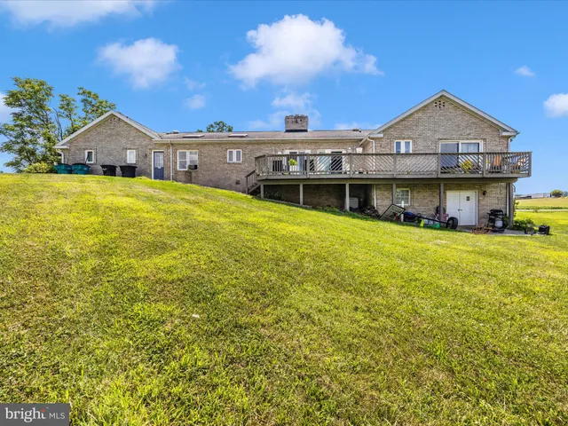 a view of roof deck with patio