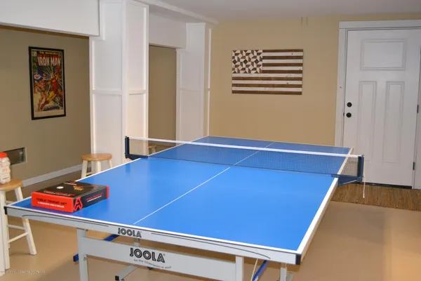 a view of an house with backyard and porch