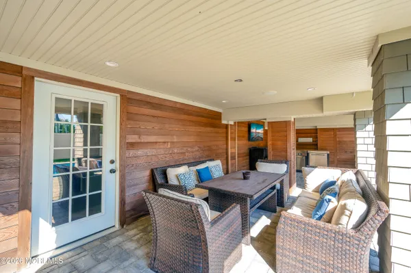 a backyard of a house with yard and outdoor seating