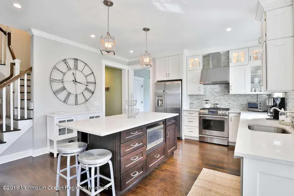 a kitchen with a table and chairs in it