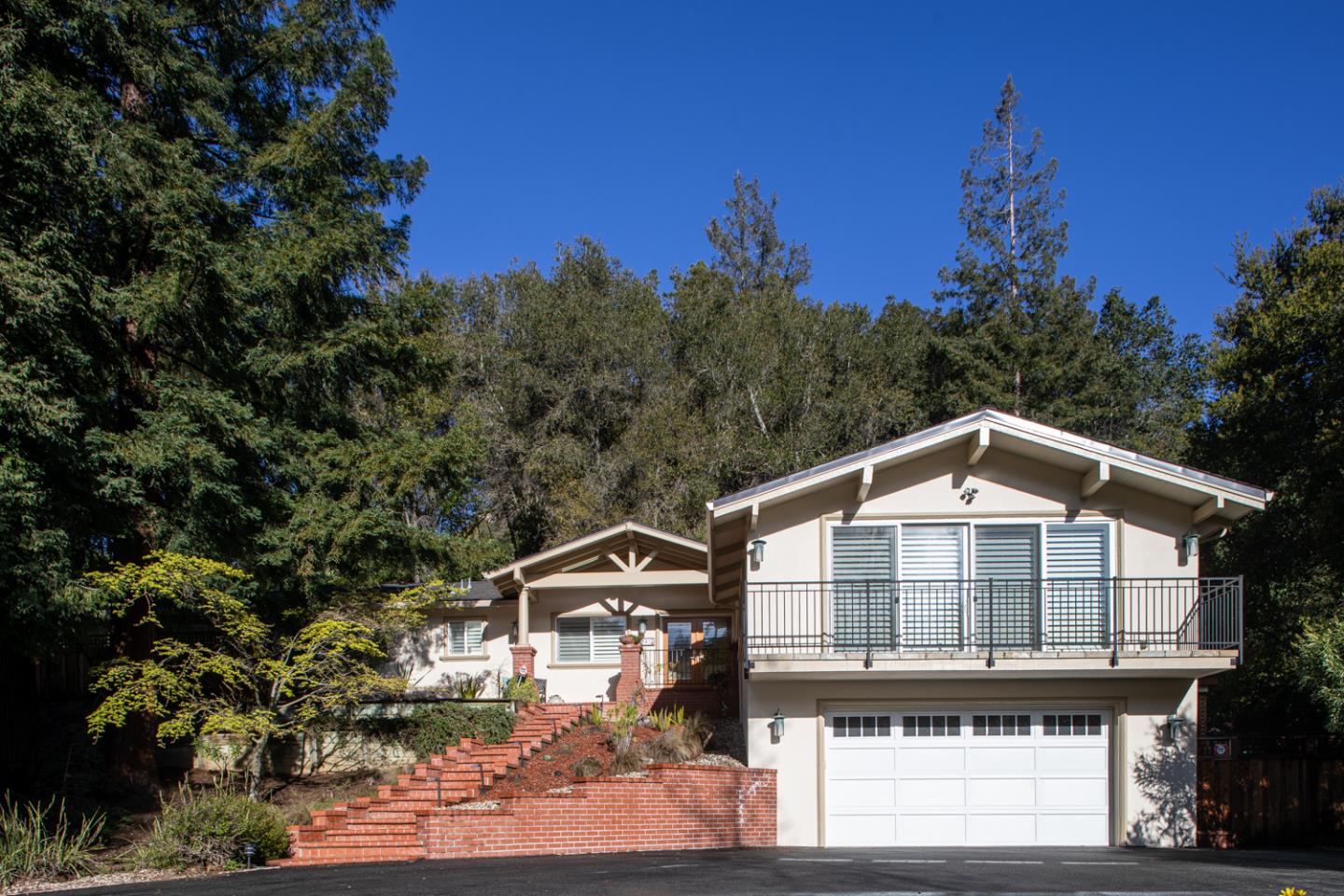 21781 Prospect Road Saratoga, CA 95070 - Photo 1 of 51 a front view of a house with a yard