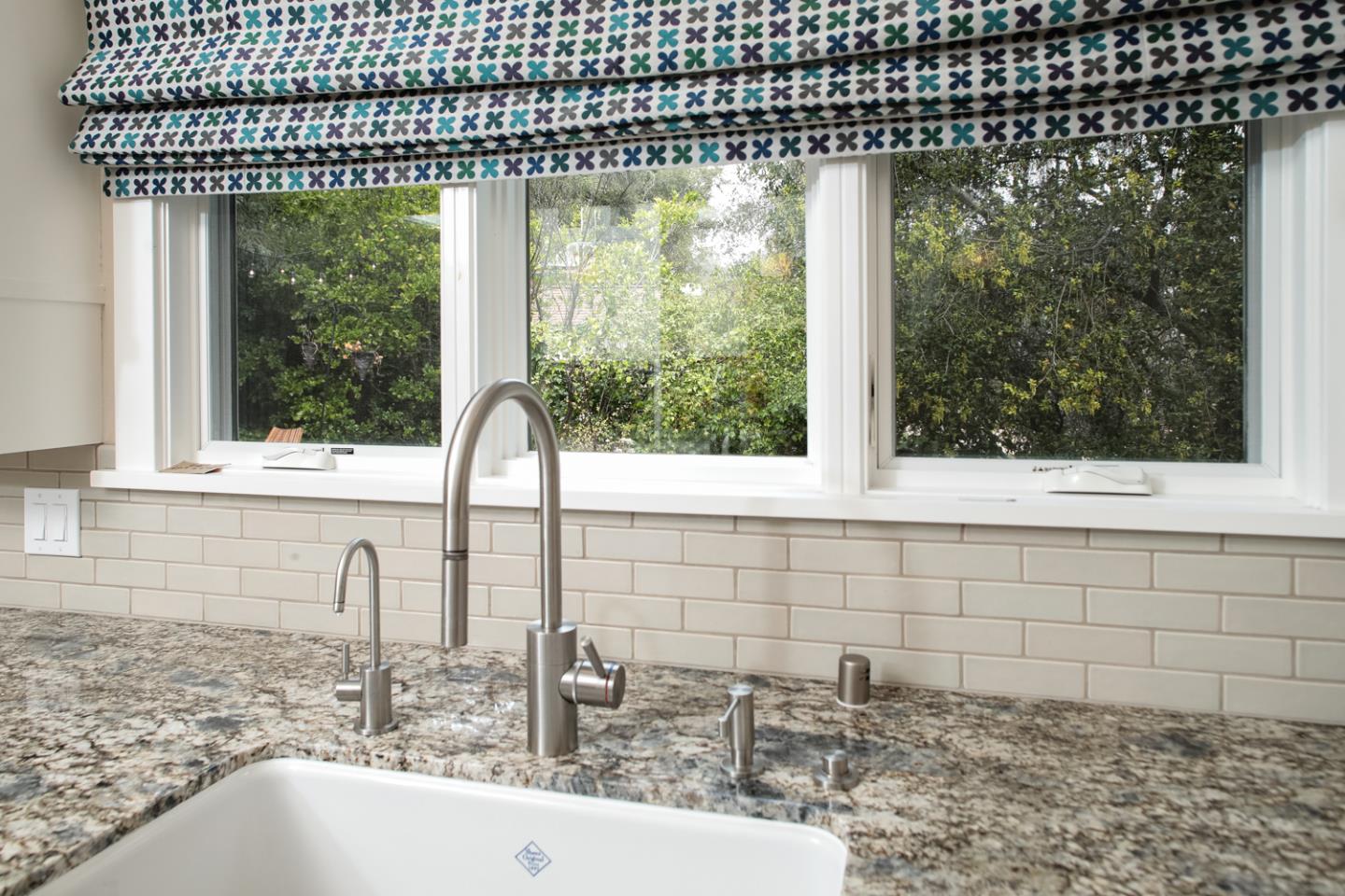 21781 Prospect Road Saratoga, CA 95070 - Photo 14 of 51 a bathroom with a sink a mirror and window