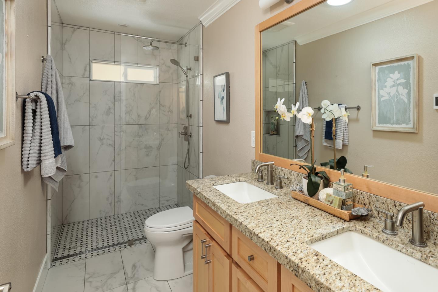 21781 Prospect Road Saratoga, CA 95070 - Photo 23 of 51 a bathroom with a granite countertop sink a toilet and shower