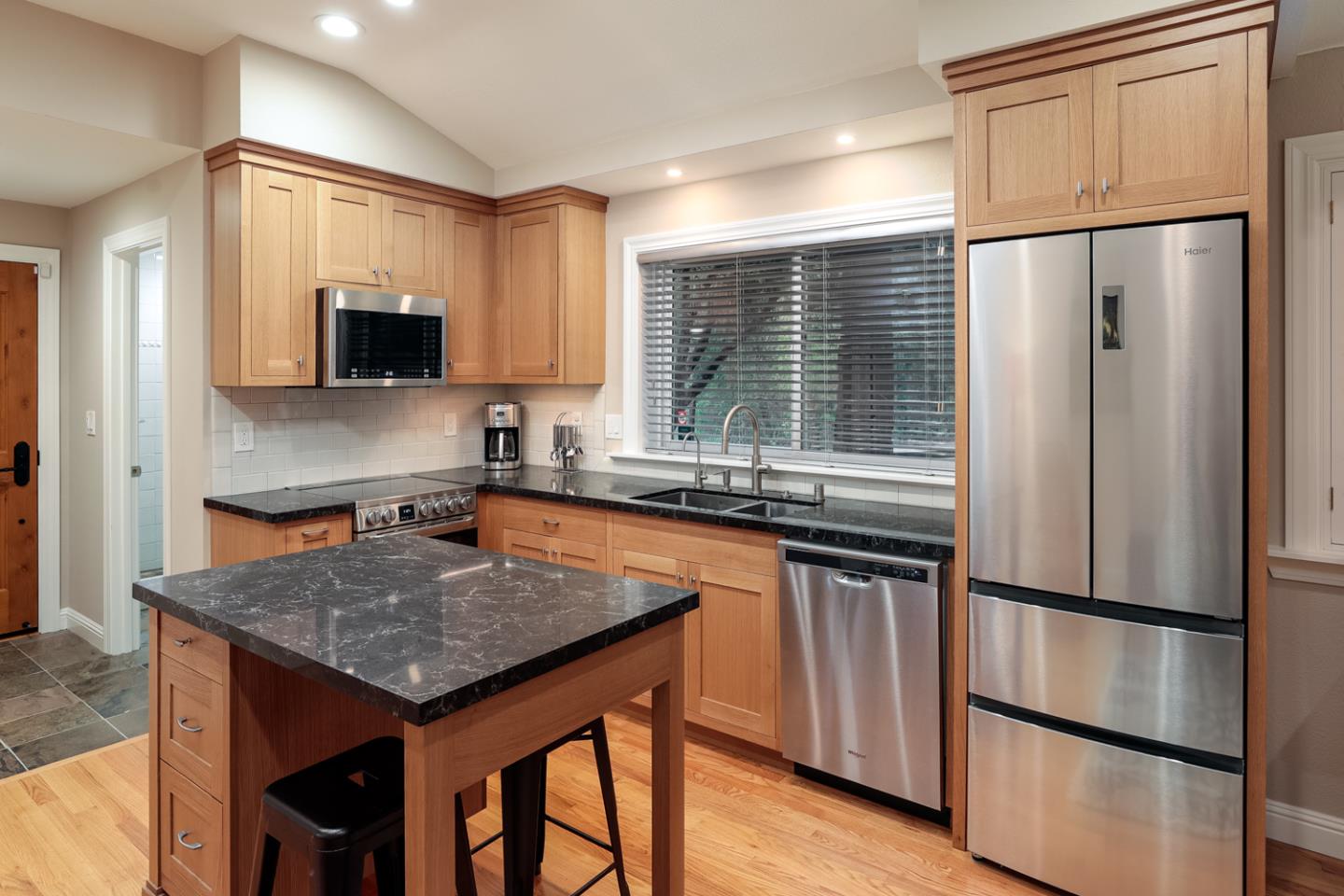21781 Prospect Road Saratoga, CA 95070 - Photo 34 of 51 a kitchen with stainless steel appliances granite countertop a refrigerator a sink a stove and a refrigerator