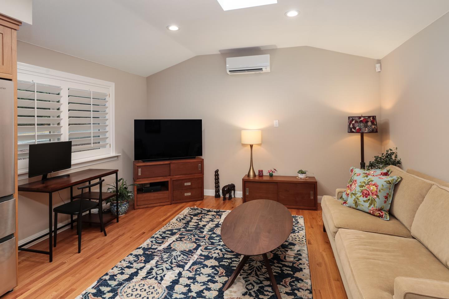 21781 Prospect Road Saratoga, CA 95070 - Photo 35 of 51 a living room with furniture and a flat screen tv
