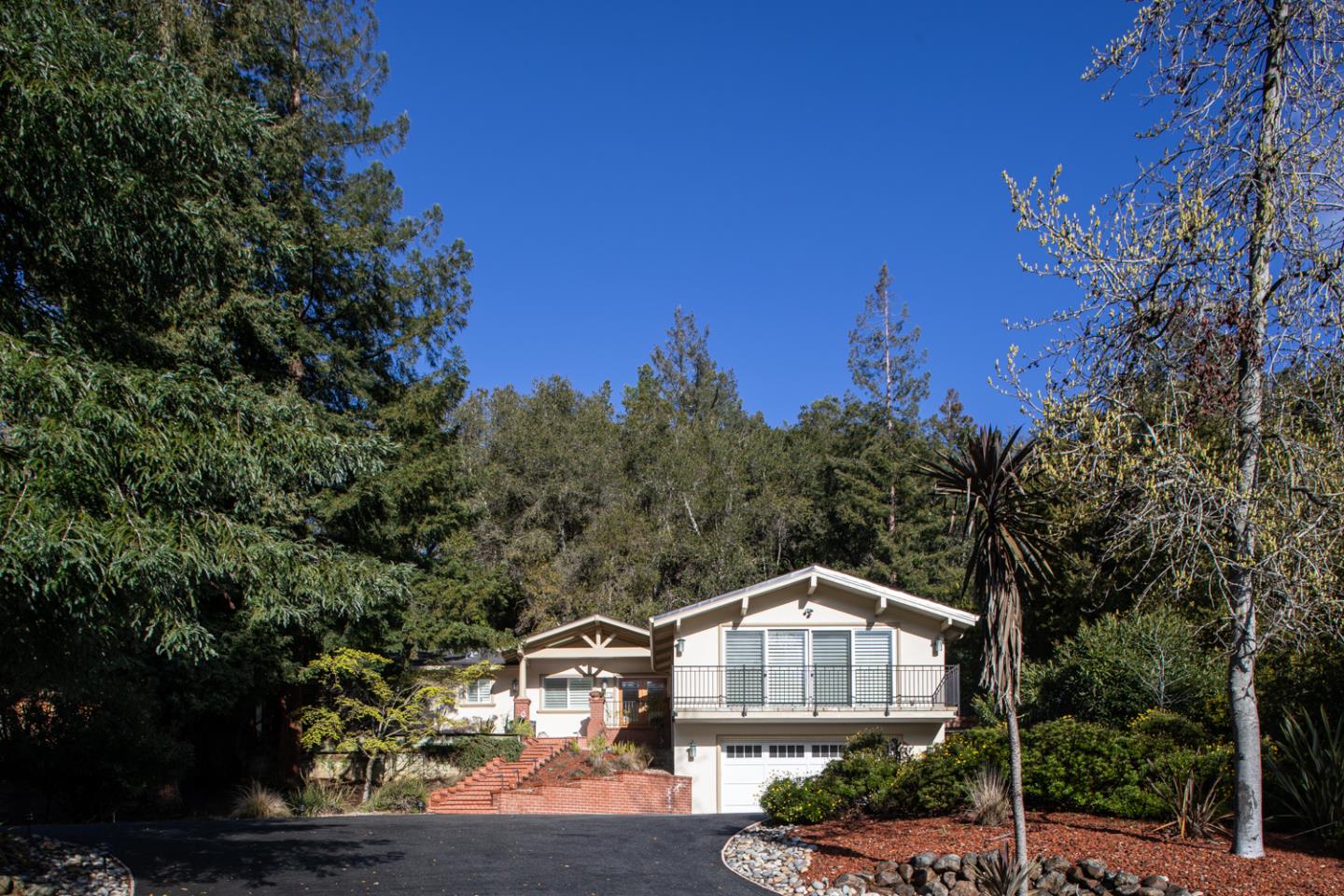 21781 Prospect Road Saratoga, CA 95070 - Photo 4 of 51 a front view of a house with a yard