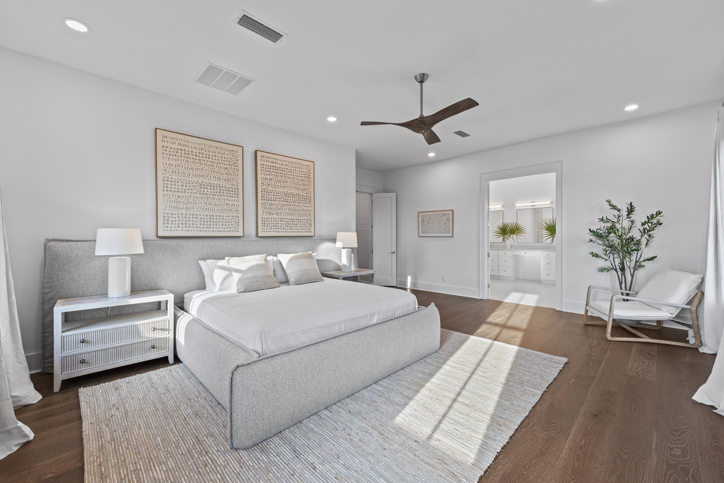 154 Maple Street Santa Rosa Beach, FL 32459 - Photo 24 of 56 a spacious bedroom with a large bed a chandelier and a couch