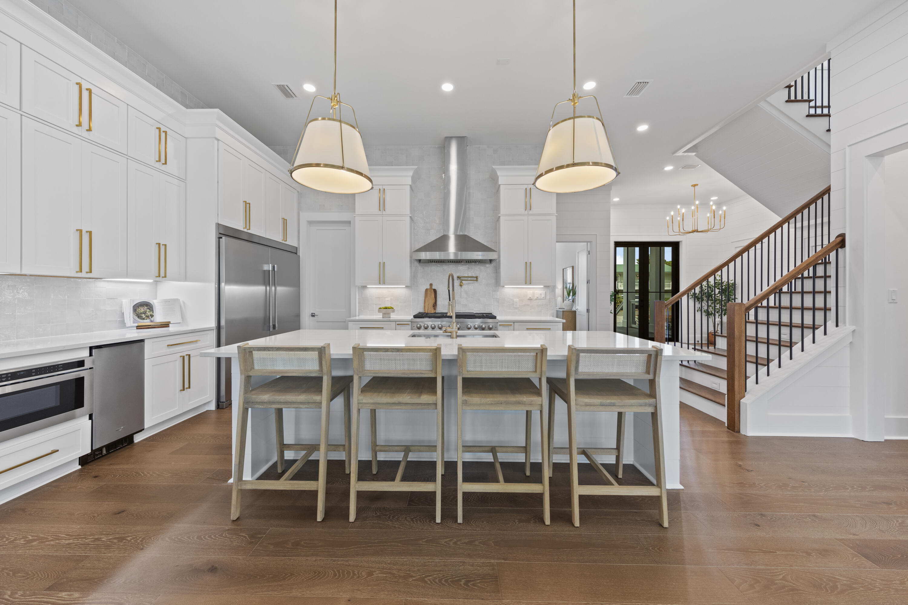 154 Maple Street Santa Rosa Beach, FL 32459 - Photo 4 of 56 a kitchen with granite countertop stainless steel appliances a dining table and chairs