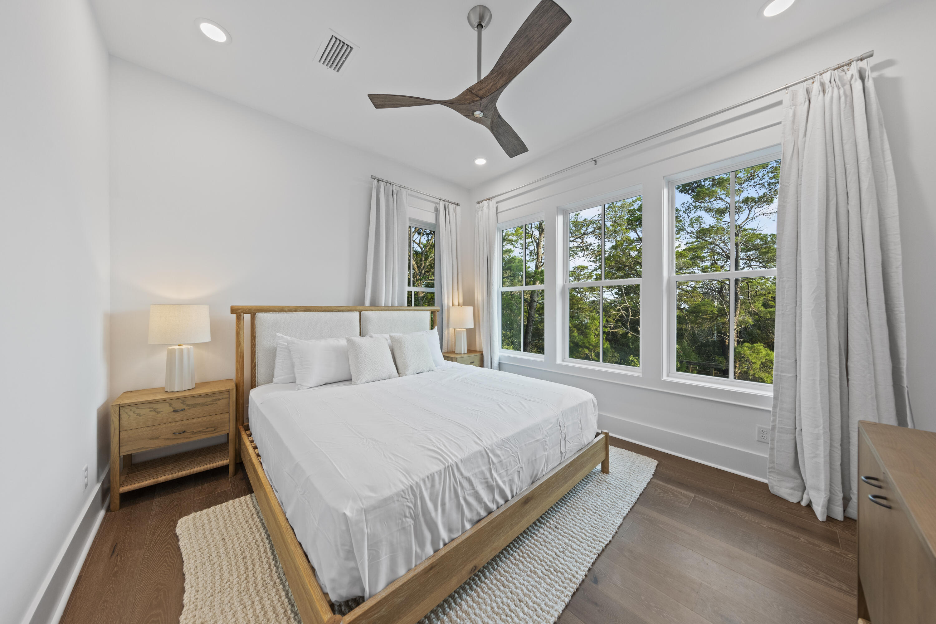 154 Maple Street Santa Rosa Beach, FL 32459 - Photo 44 of 56 a bedroom with a large bed and a large window