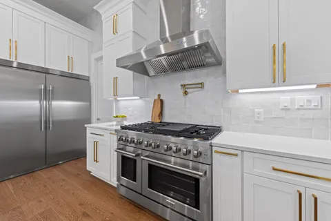 an open kitchen with a table and chairs