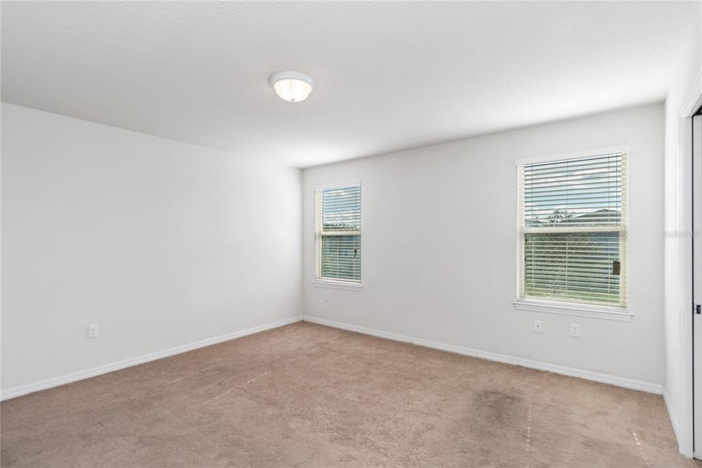 3566 Southern Cross Loop Kissimmee, FL 34744 - Photo 21 of 32 an empty room with a window