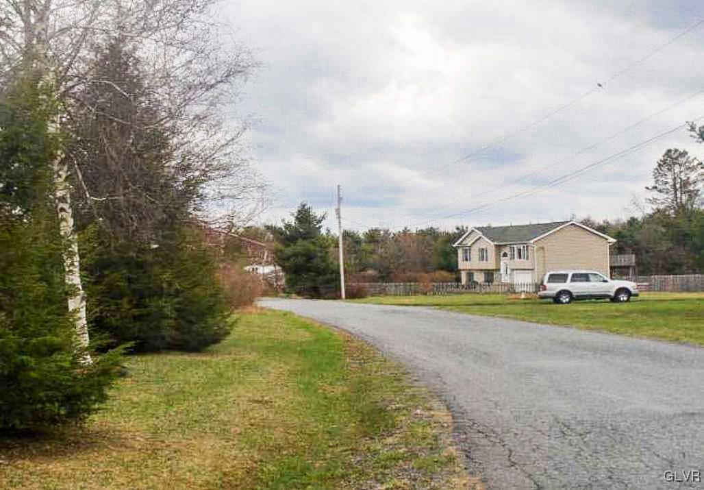 124 Bull Run Long Pond, PA 18334 - Photo 12 of 13 a view of big house with a big yard and large trees